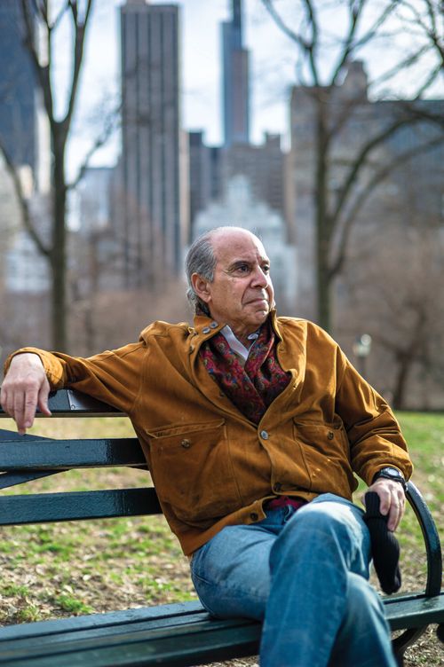 Iranian-American Author Hassan Nemazee sitting on a bench in Central Park, New York City